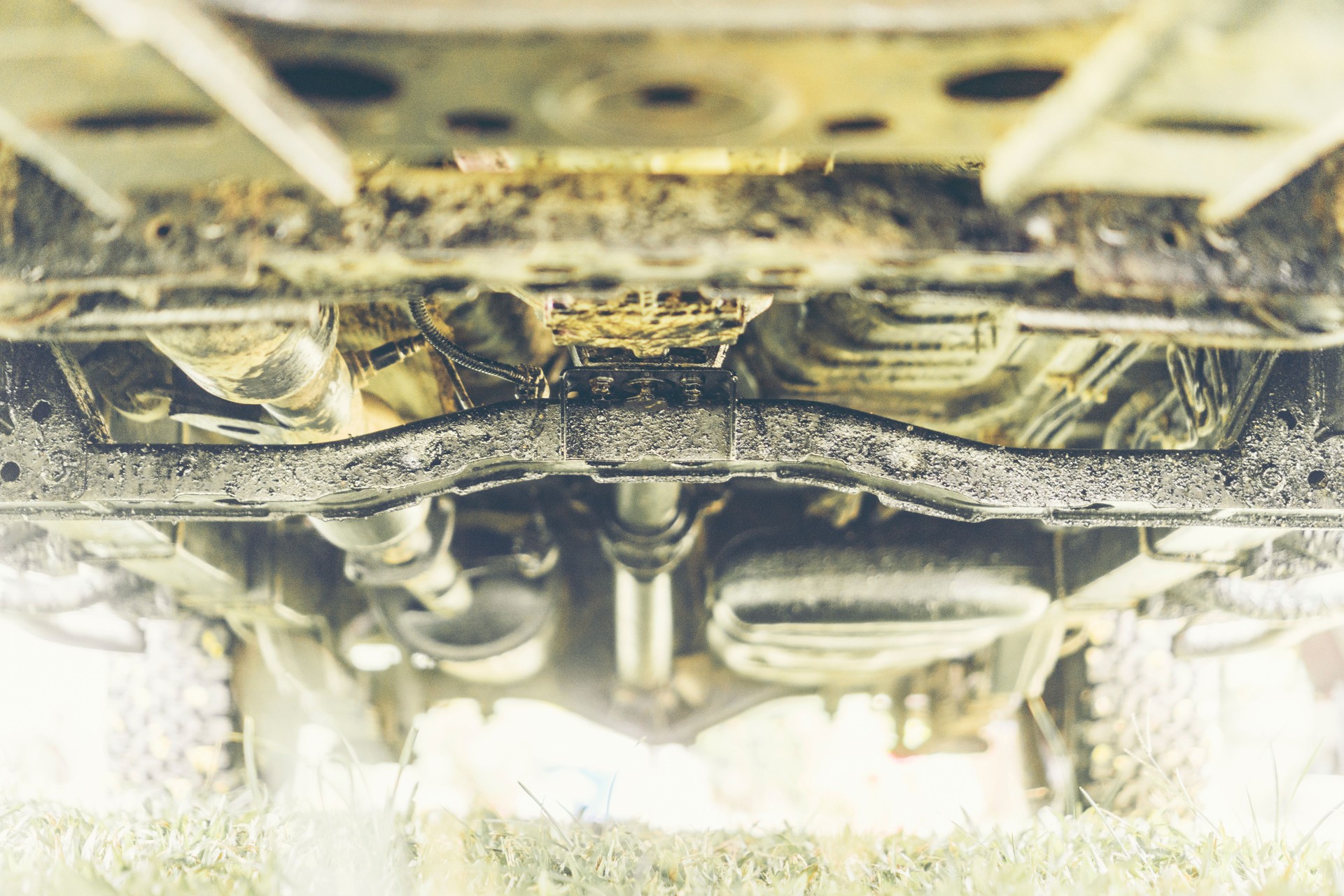 The car is dirty with asphalt oil.